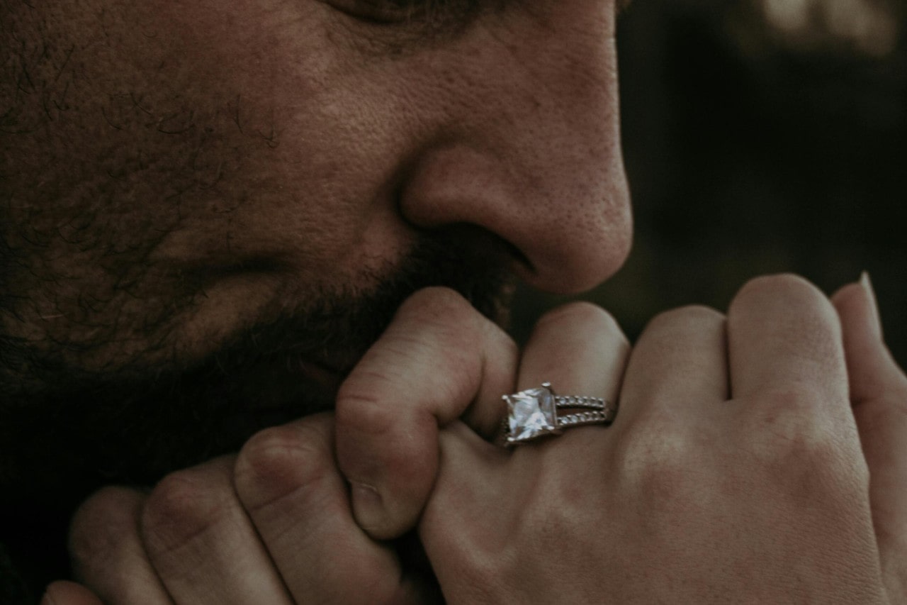 Princess cut diamond ring on a woman’s finger