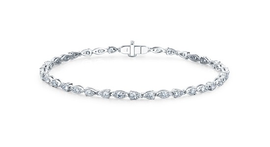 a white gold line bracelet with diamond accents