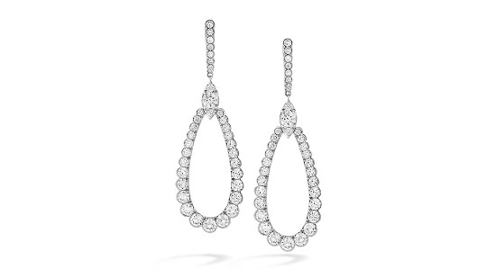 a pair of white gold diamond drop earrings by Hearts On Fire